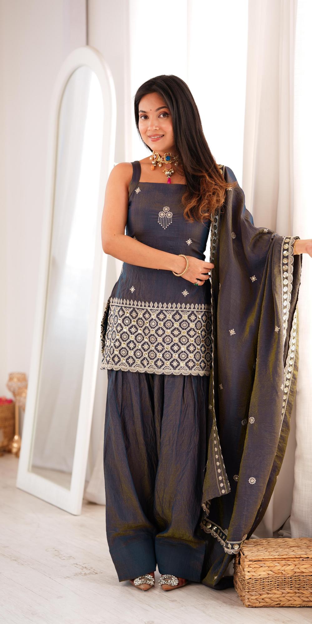 Grey embroidered salwar suit with dupatta.