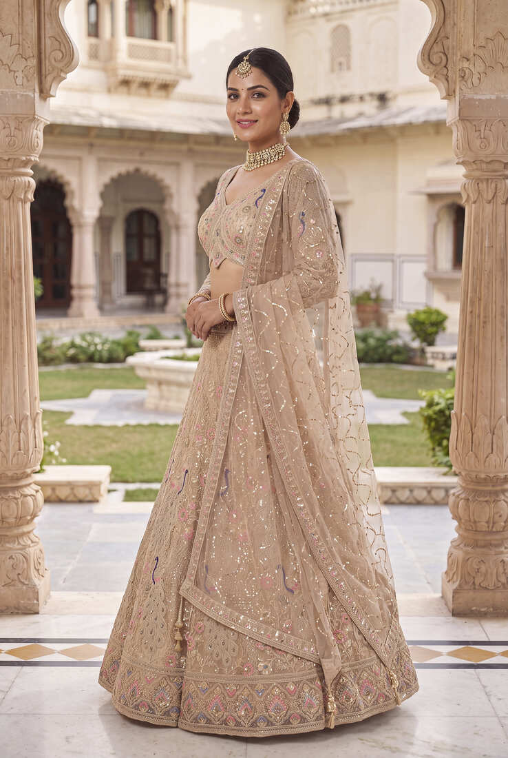 Elegant Floral Patterned Net Lehenga Set in Beige with Embellished Blouse and Dupatta with light gold colour.