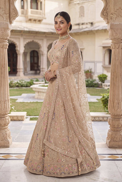 Elegant Floral Patterned Net Lehenga Set in Beige with Embellished Blouse and Dupatta with light gold colour.