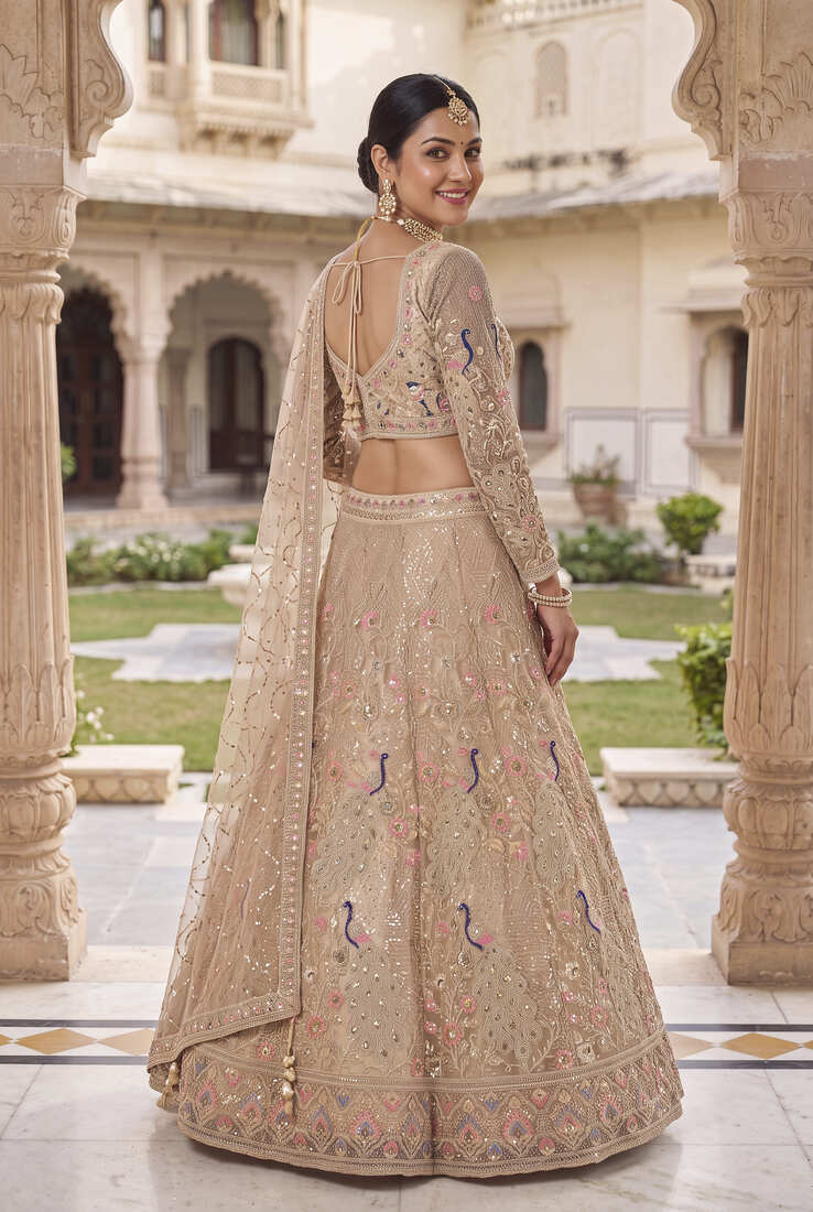 Elegant Floral Patterned Net Lehenga Set in Beige with Embellished Blouse and Dupatta with light gold colour.