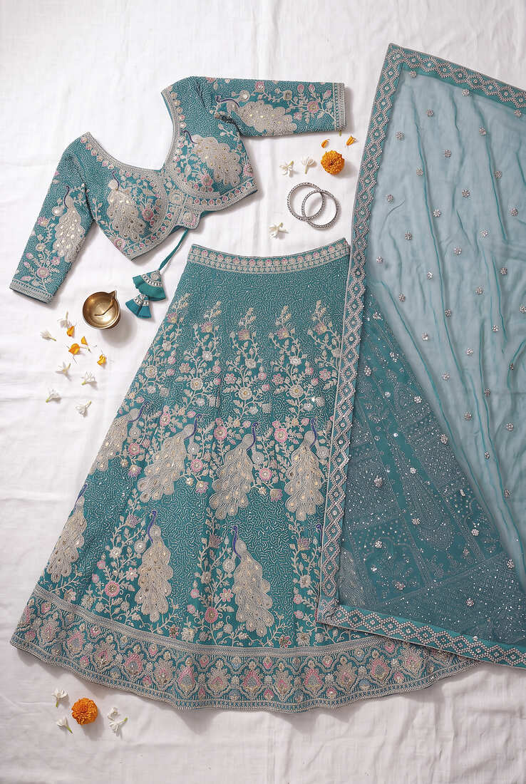 Elegant Teal Blue Embroidered Lehenga Choli with Peacock Motif and Matching Dupatta