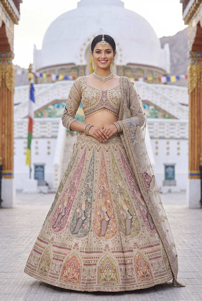 Elegant Beige Bridal Lehenga Set Featuring Traditional Peacock Motifs and Intricate Hand Embroidery