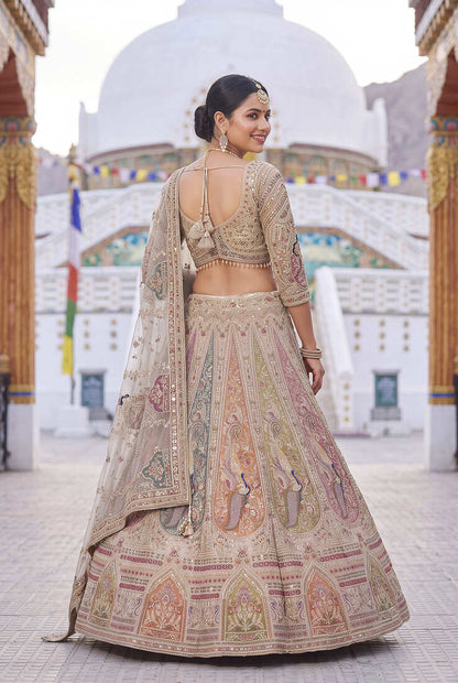Elegant Beige Bridal Lehenga Set Featuring Traditional Peacock Motifs and Intricate Hand Embroidery