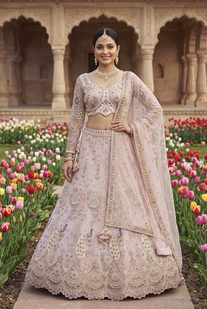 Designer Embroidered Pastel Pink Lehenga Choli Set with Peacock Motif and Net Dupatta for Wedding and Festive Wear