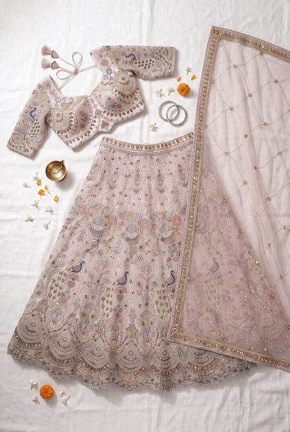 Designer Embroidered Pastel Pink Lehenga Choli Set with Peacock Motif and Net Dupatta for Wedding and Festive Wear