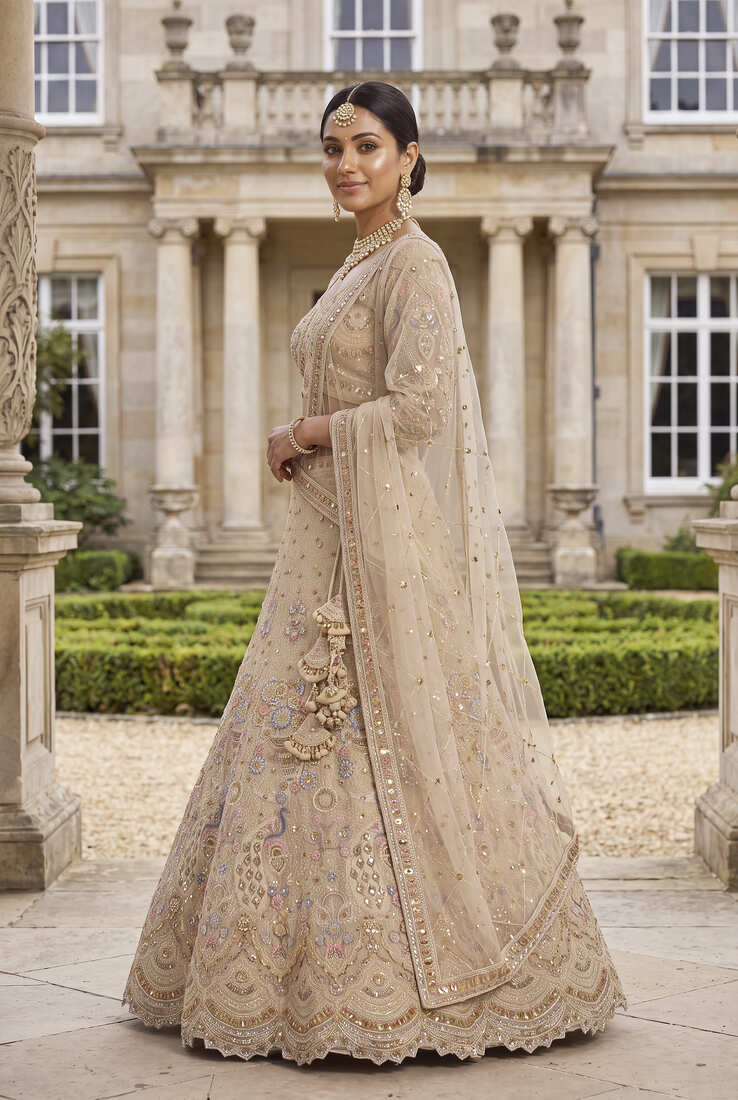 Light skin colour Beige Embroidered Bridal Lehenga Choli with Pastel Floral Motifs and Detailed Zardosi Work