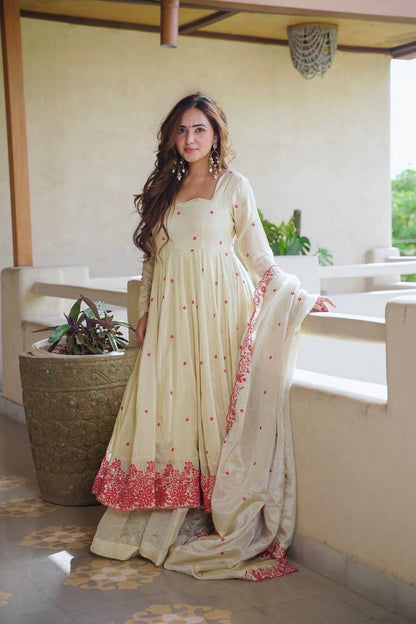 Elegant ivory anarkali suit with embroidery.