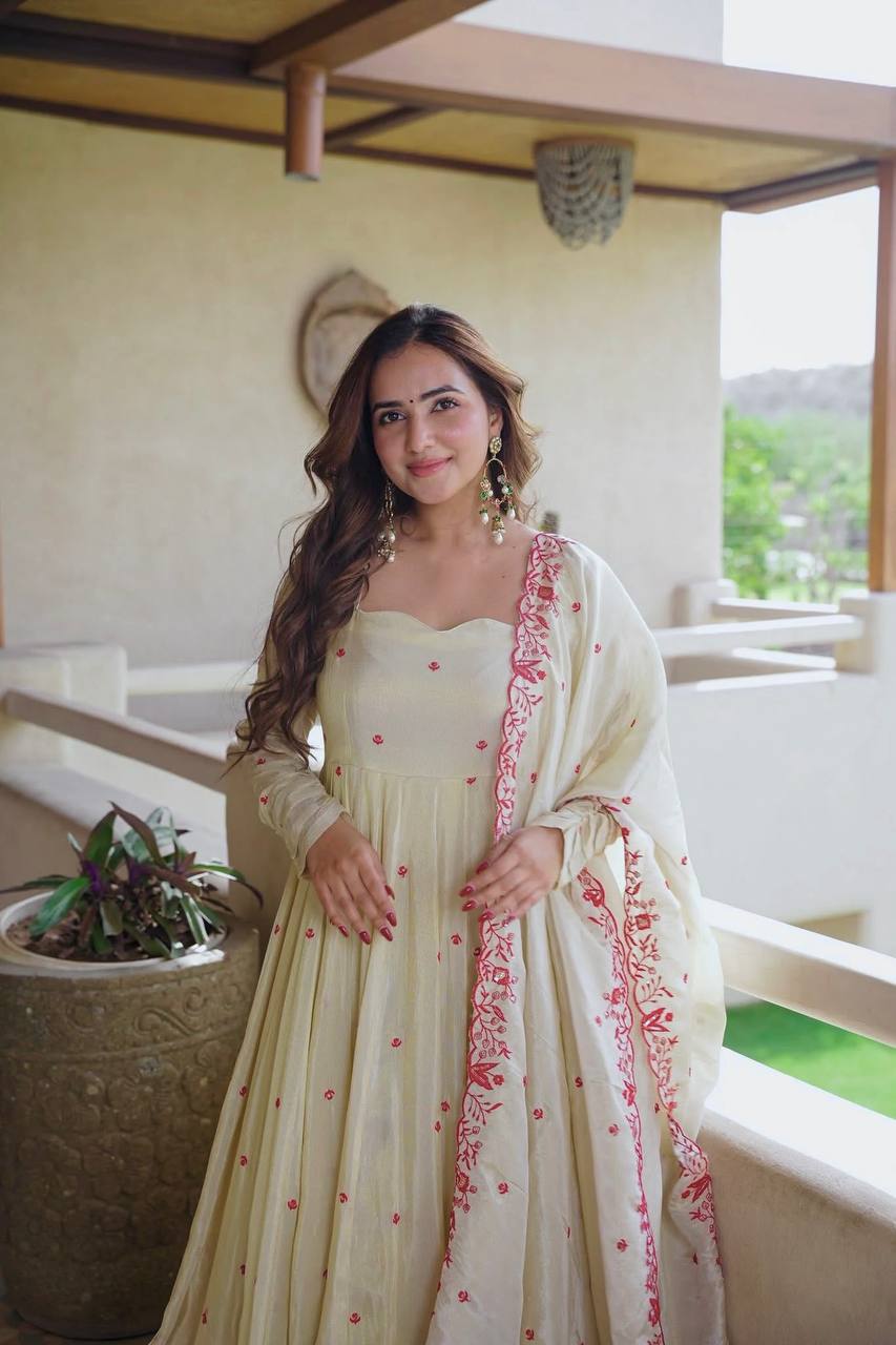 Elegant ivory anarkali suit with embroidery.
