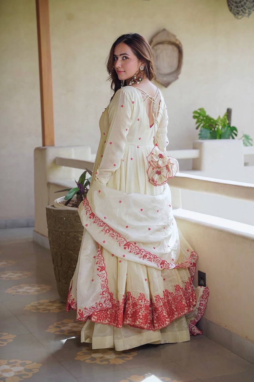 Elegant ivory anarkali suit with embroidery.