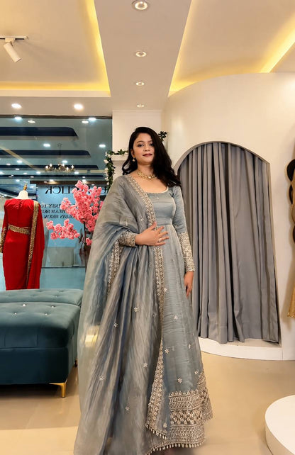 Embroidered Anarkali gown with matching dupatta.