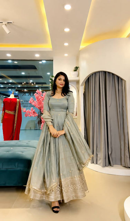 Embroidered Anarkali gown with matching dupatta.