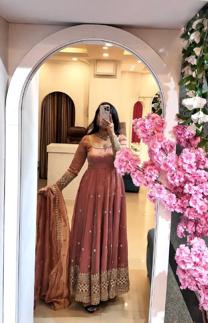 Embroidered Anarkali gown with matching dupatta.